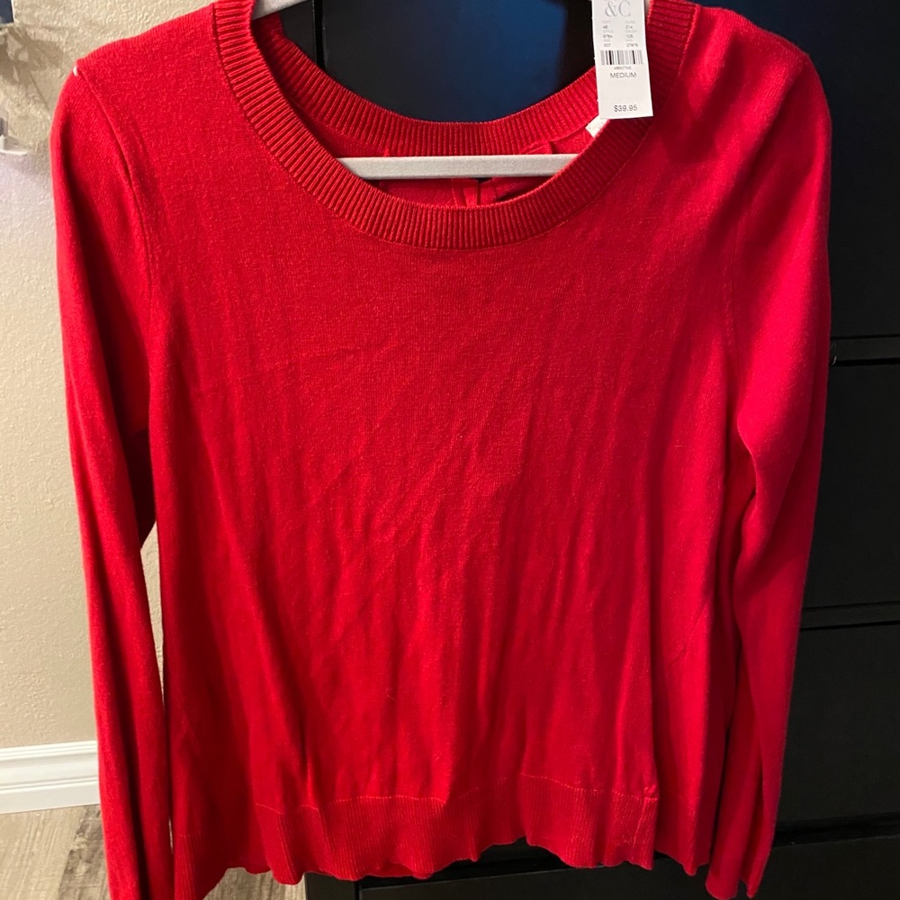 Brand new red sweater with a twist